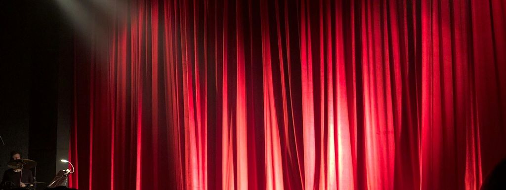 A warm theatre and community events banner representing demo events on Bookaroo.